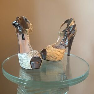 A pair of 5 inch heals by Claudia Ciuti. Beige and silver. Never been worn.
